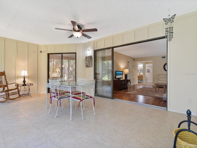 dining room featuring ceiling fan and light tile flooring