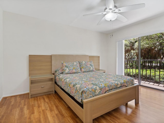 bedroom featuring access to outside, ceiling fan, and light wood-type flooring