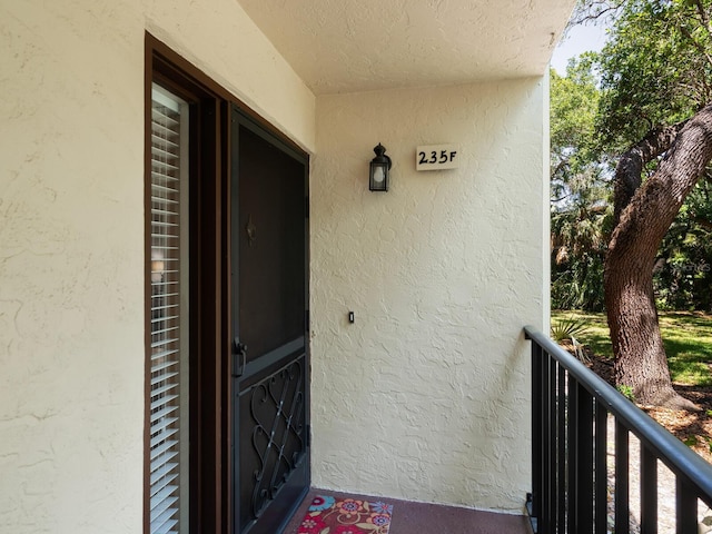 entrance to property with a balcony