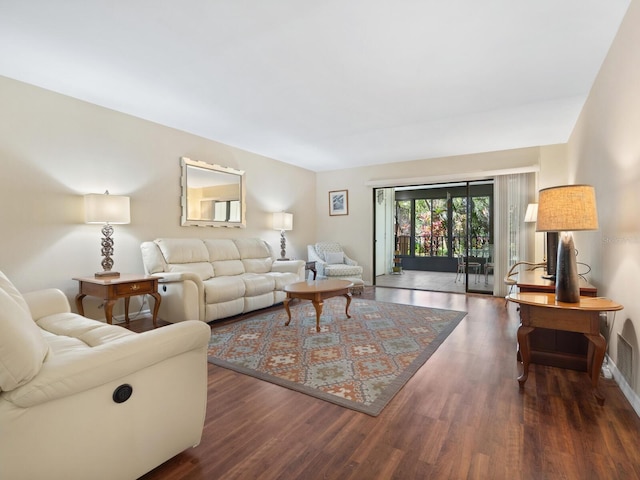 living room with dark hardwood / wood-style flooring