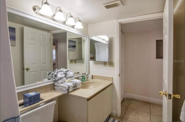 bathroom with oversized vanity and tile floors