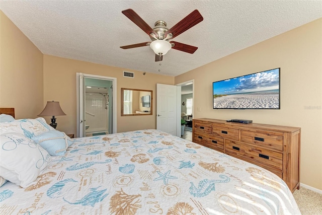 carpeted bedroom featuring a textured ceiling, ceiling fan, and connected bathroom