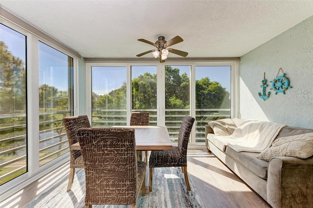 sunroom / solarium with ceiling fan