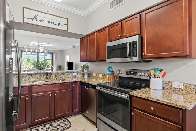 kitchen with appliances with stainless steel finishes, sink, a notable chandelier, crown molding, and light stone countertops