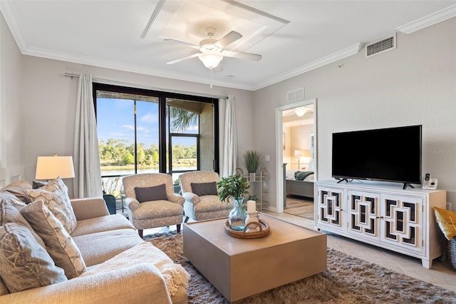 living room featuring ceiling fan, light tile floors, and ornamental molding