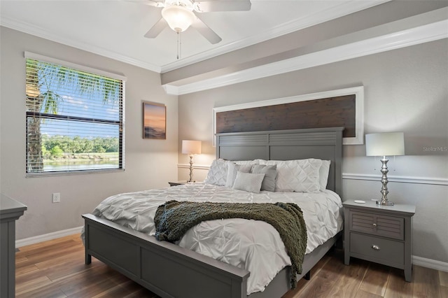 bedroom featuring ceiling fan, dark wood-type flooring, and crown molding