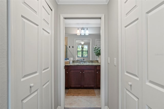 bathroom with ornamental molding, tile floors, and oversized vanity