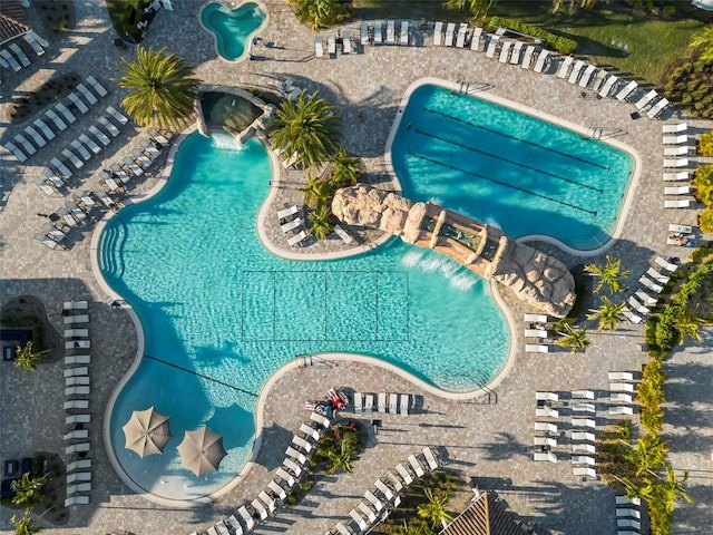 view of swimming pool with pool water feature