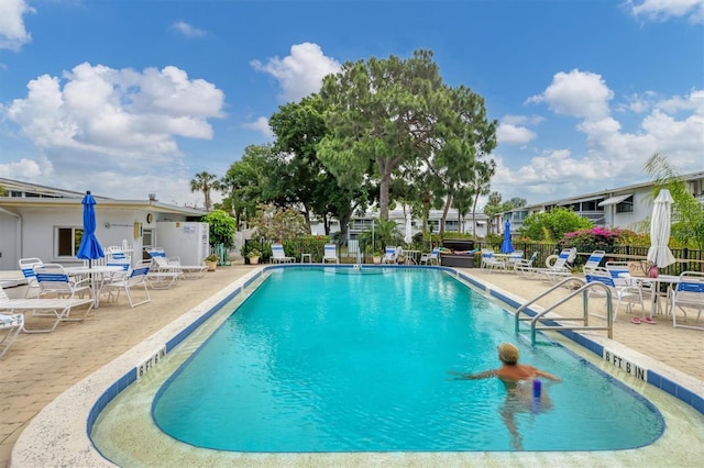 view of swimming pool featuring a patio