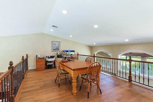 dining space featuring light wood finished floors, visible vents, vaulted ceiling, and recessed lighting