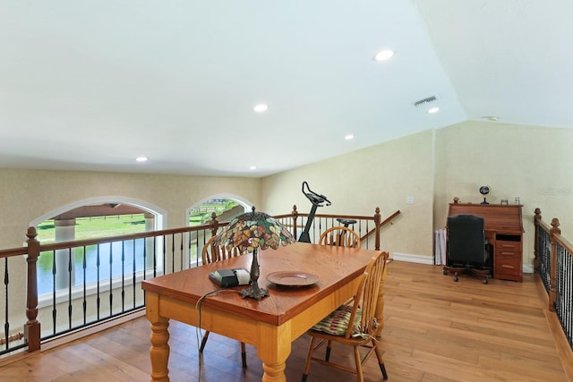 dining room with lofted ceiling, visible vents, light wood-style flooring, and recessed lighting