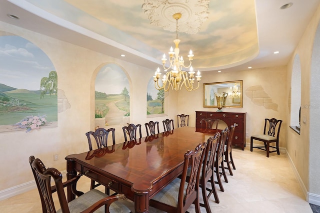 dining area with a chandelier, baseboards, a raised ceiling, and recessed lighting