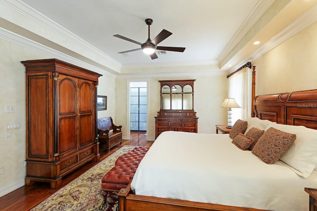 bedroom with dark wood-style floors, ornamental molding, baseboards, and a ceiling fan