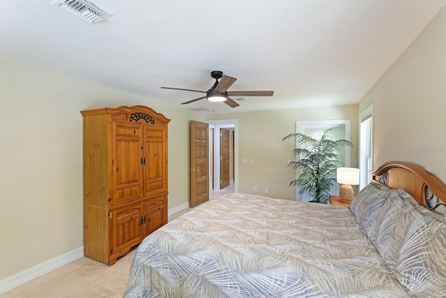 bedroom with a ceiling fan, visible vents, and baseboards