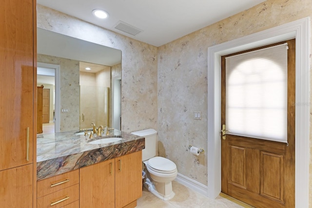 bathroom with visible vents, toilet, a shower stall, vanity, and tile patterned flooring