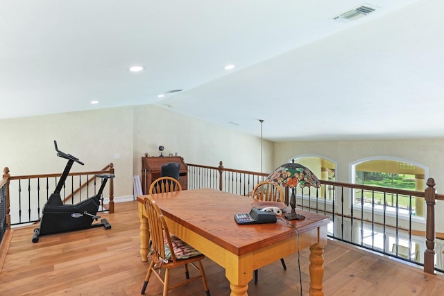 dining area featuring vaulted ceiling, recessed lighting, visible vents, and light wood-style floors