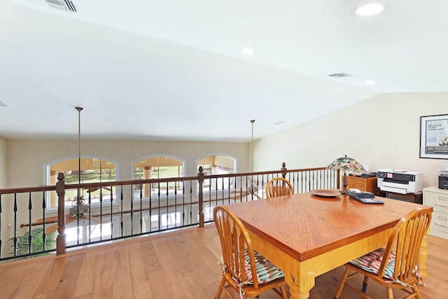 dining space featuring lofted ceiling, light wood-style floors, visible vents, and recessed lighting