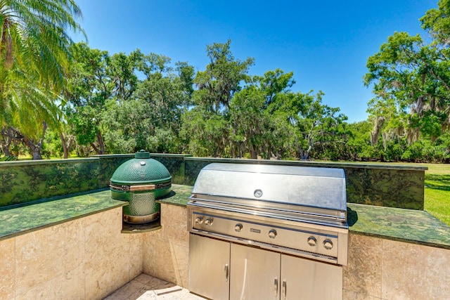 view of patio with exterior kitchen and area for grilling