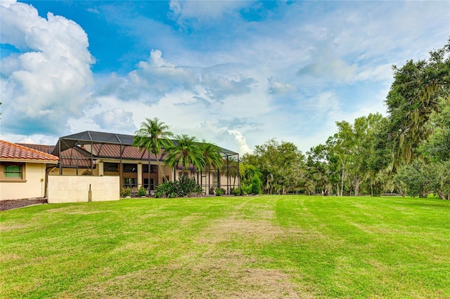 view of yard with a lanai