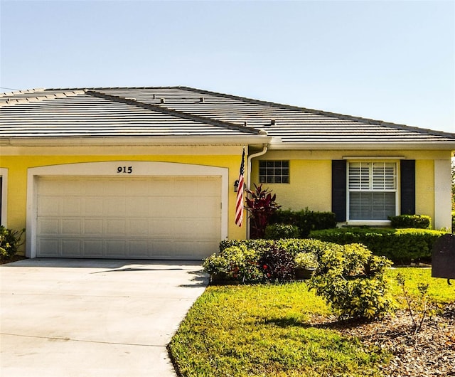 ranch-style home featuring a garage