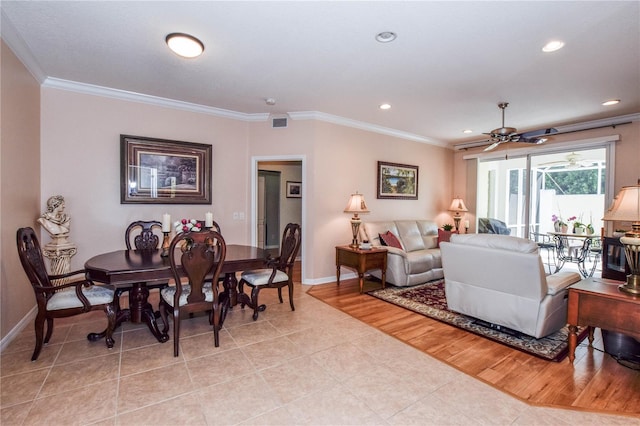 living room with ceiling fan, light hardwood / wood-style floors, and ornamental molding