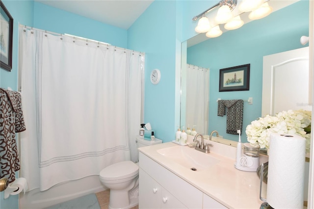 bathroom featuring vanity with extensive cabinet space, toilet, and tile floors