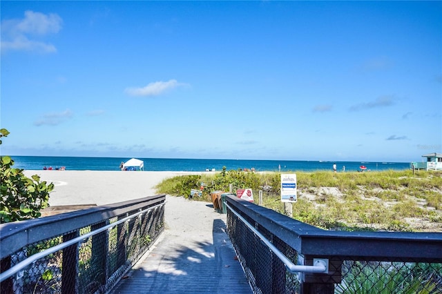 property view of water featuring a beach view