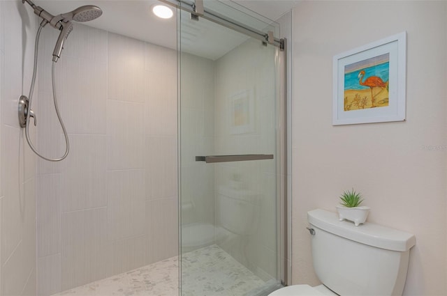 bathroom with walk in shower and toilet