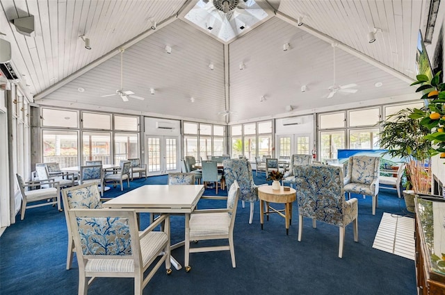 sunroom / solarium featuring a healthy amount of sunlight and ceiling fan