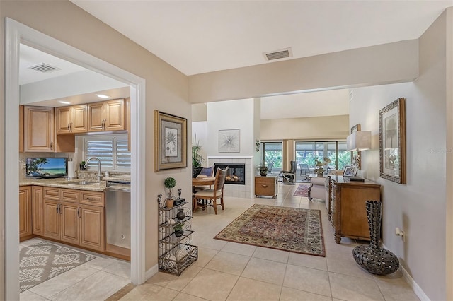 interior space with sink and light tile flooring