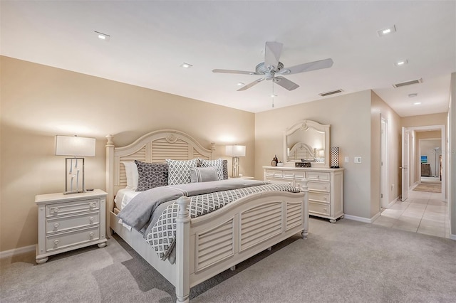 bedroom with light colored carpet and ceiling fan