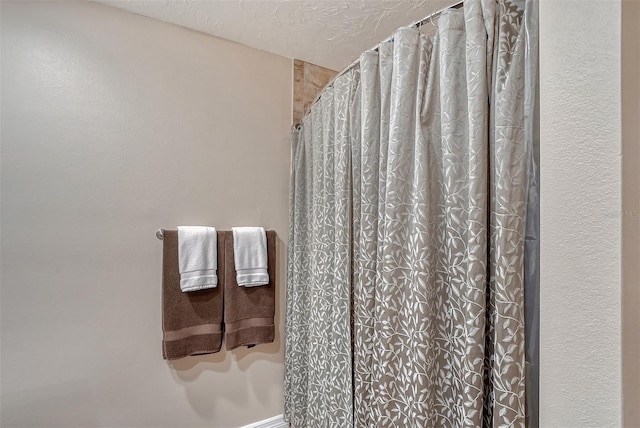 bathroom with a textured ceiling