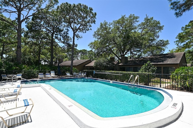 view of swimming pool featuring a patio