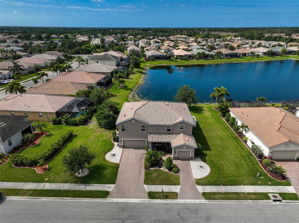 birds eye view of property featuring a water view