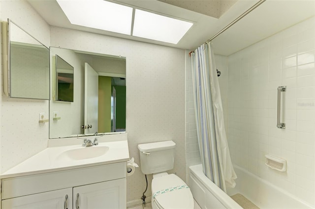 full bathroom featuring vanity with extensive cabinet space, toilet, and shower / tub combo with curtain