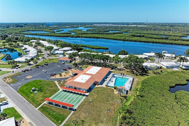 birds eye view of property featuring a water view