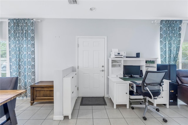 tiled home office with plenty of natural light