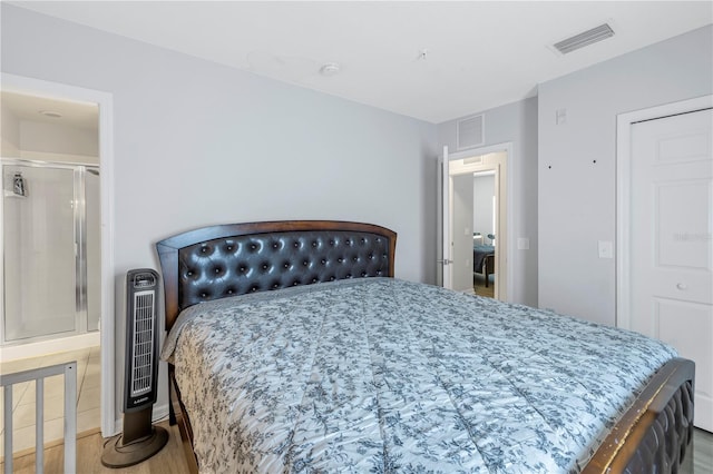 bedroom with hardwood / wood-style flooring