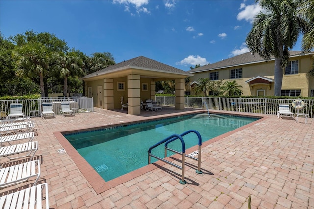 view of swimming pool with a patio