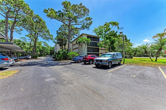 view of parking with a carport