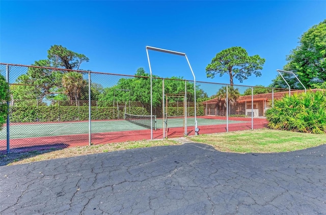 exterior space with tennis court