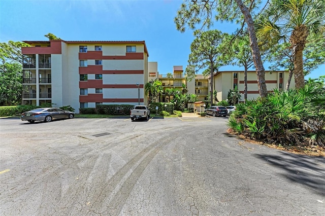 view of property with uncovered parking