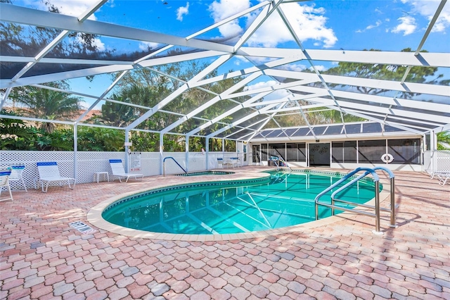 view of pool featuring a lanai and a patio