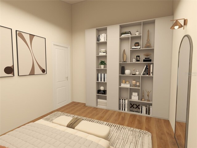 bedroom with hardwood / wood-style flooring