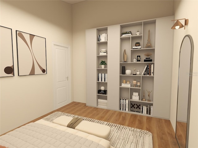 bedroom featuring wood finished floors