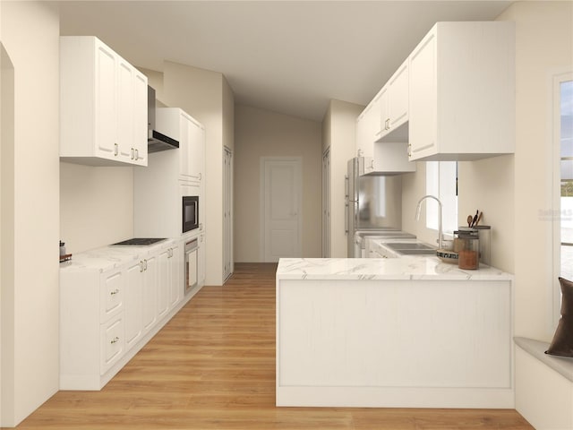 kitchen with a peninsula, a sink, black appliances, white cabinets, and light wood-type flooring