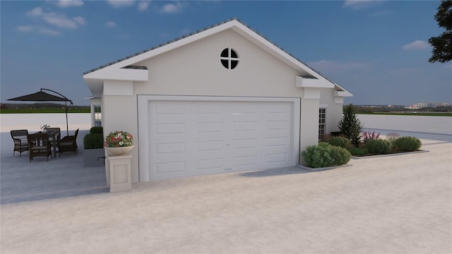 garage with concrete driveway