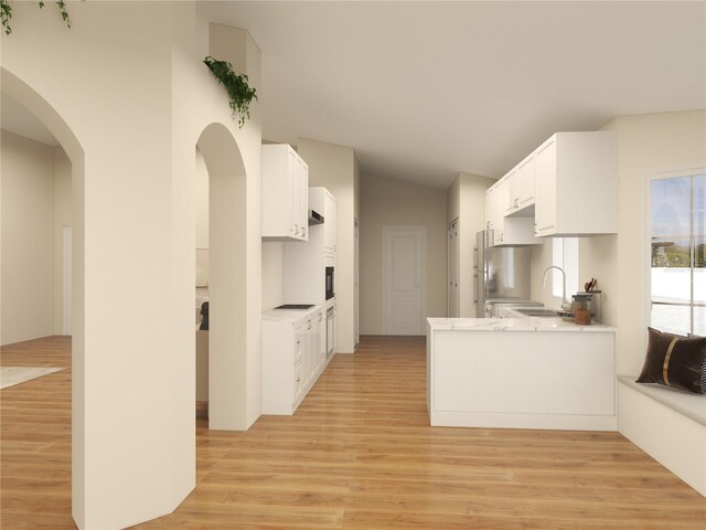 kitchen with lofted ceiling, sink, white cabinetry, kitchen peninsula, and light wood-type flooring