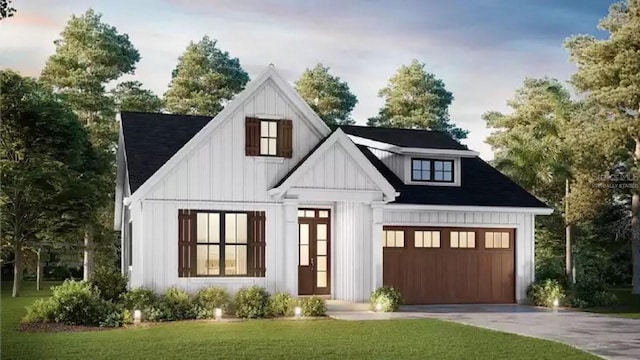 view of front of house featuring a front yard, board and batten siding, and driveway