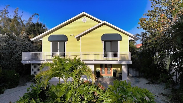 view of front of property with a balcony